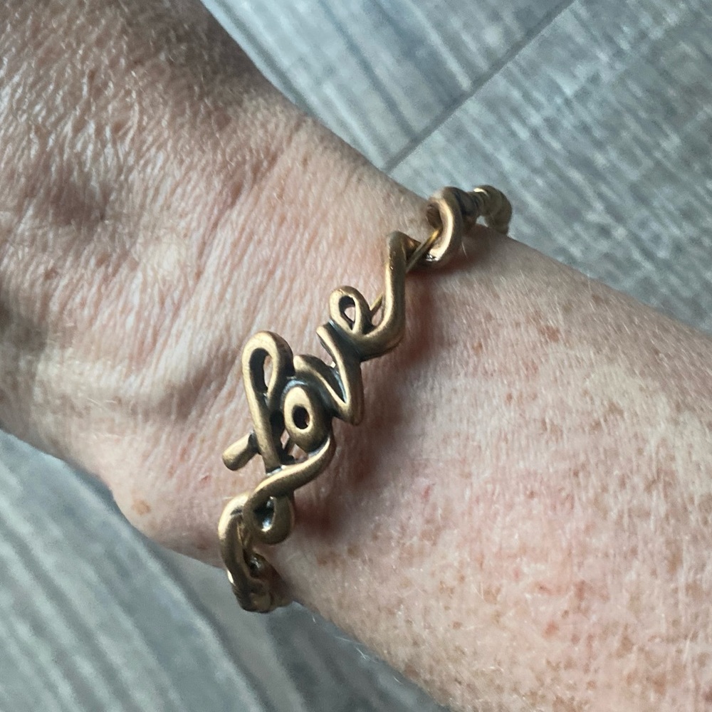 Alex and Ani gold toned bracelet with beading and love inscription